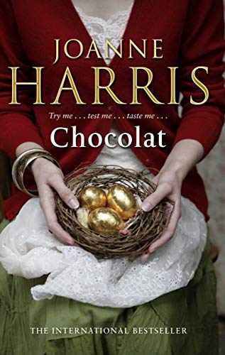 The alt text for the image is: "Book cover with bird's nest and chocolates on blue background."