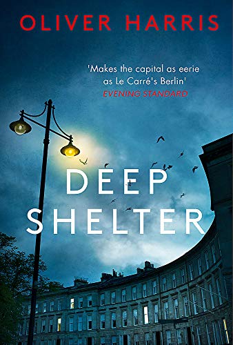 Book cover for Deep Shelter by Oliver Harris showing a streetlamp and dark buildings.