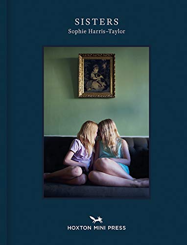 Book cover featuring two young girls seated closely together.