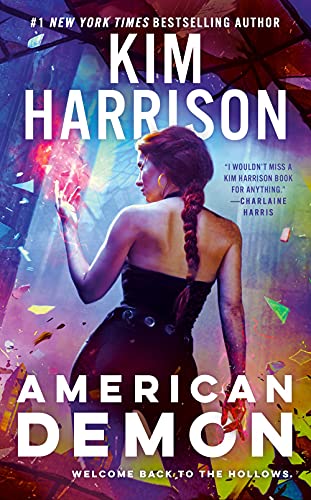 Book cover: woman with glowing hands, titled "American Demon (Hollows)".