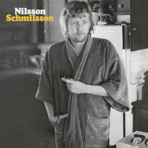 Black and white vinyl album cover featuring a man in a striped robe.