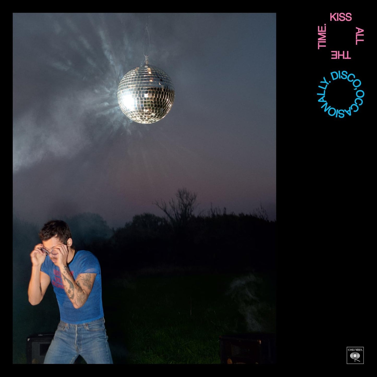 Harry Styles album cover: disco ball, man kneeling in grass.