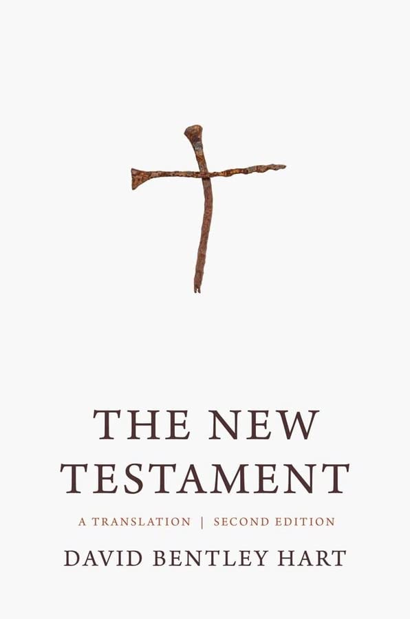 White book cover with a wooden cross and the title "The New Testament.