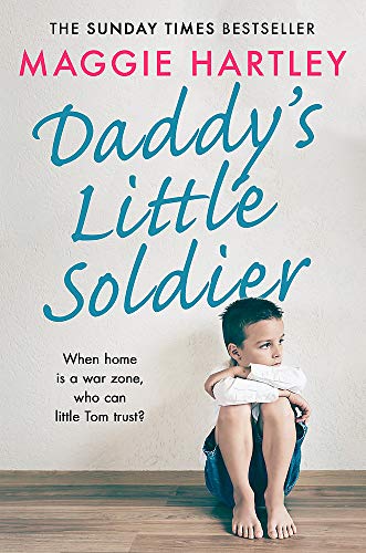 Book cover featuring a young boy sitting on the floor with arms crossed.
