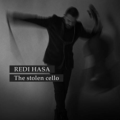 Black and white album cover with a man in a dynamic pose, text overlay.