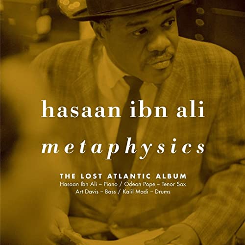 Sepia-toned portrait of Hasaan Ibn Ali wearing a hat, with album text overlay.