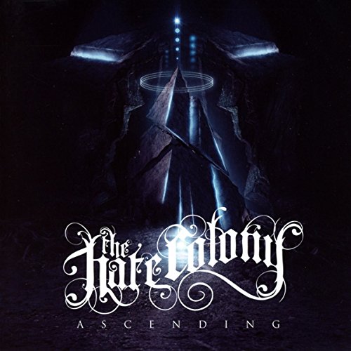 Album cover for "Hate Colony - Ascending" featuring dark, rocky structures and glowing light.