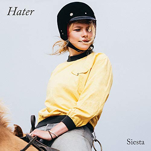 Vinyl album cover: woman in riding helmet and yellow jacket.