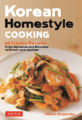 Cookbook cover featuring a plate of vibrant, spicy Korean kimchi.