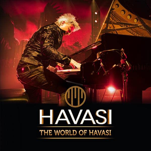 Pianist Havasi performing on a grand piano with red stage lighting.