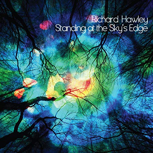 Album cover showing silhouetted tree branches against a vibrant, abstract blue and yellow sky.