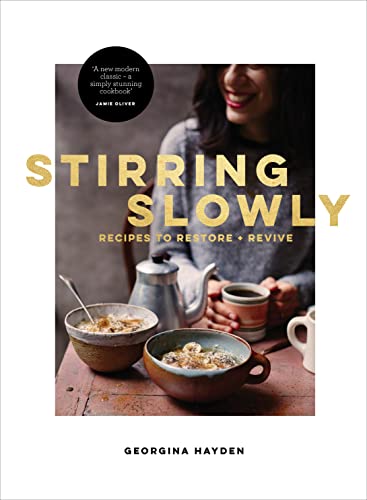 Cookbook cover with woman, bowls of food, and gold title "Stirring Slowly".