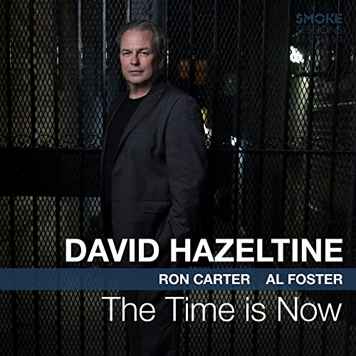 David Hazeltine stands in front of a metal gate on this album cover.