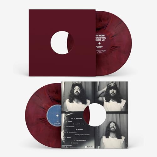 Red-swirled vinyl record and album cover featuring a portrait of a man.