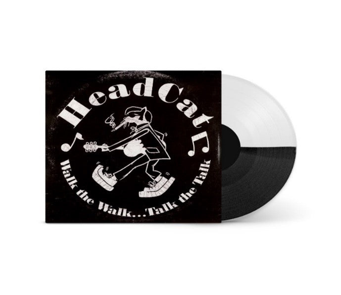 Black and white vinyl record with a black album cover featuring a cartoon character.