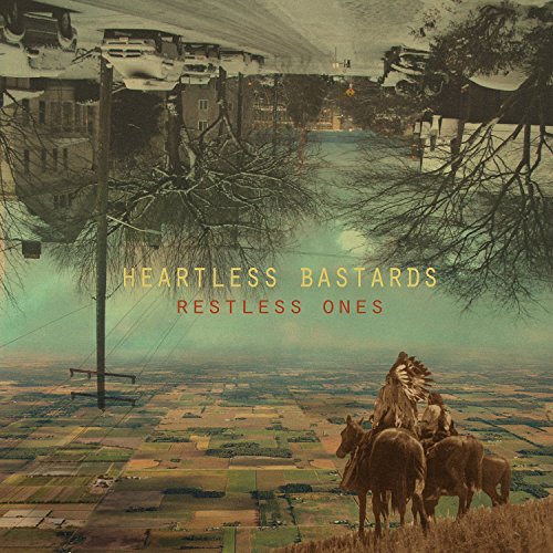 Album cover for Heartless Bastards’ “Restless Ones” featuring a rural landscape.