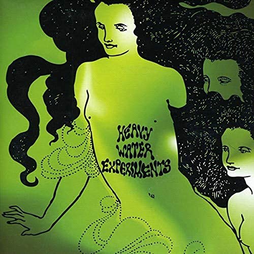 Green album cover with line-drawn figures and the text "Heavy Water Experiments".