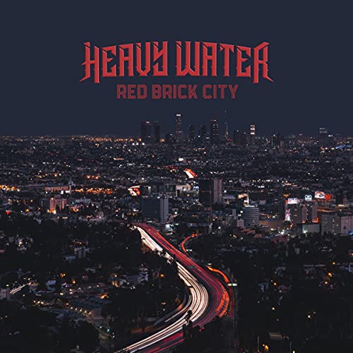 Album cover with cityscape at night, highway lights, and red "Heavy Water" text overlay.