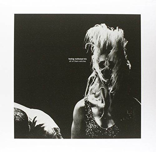 Vinyl album cover: black and white portrait of a person with long hair.
