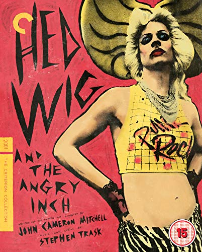 A blonde person in a yellow top stands against a red background with text.