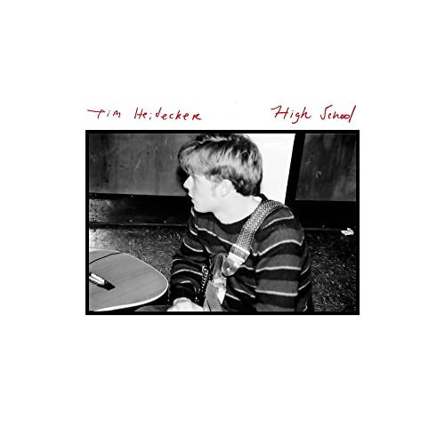Black and white album cover featuring a young man with a guitar.