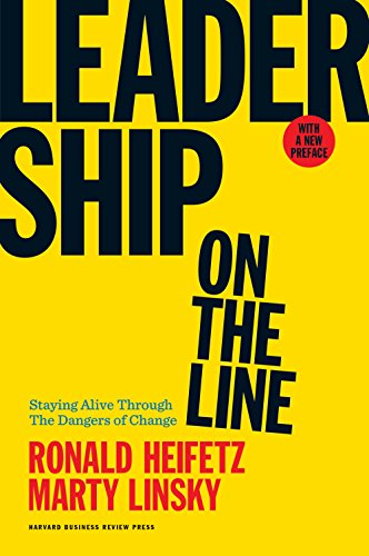 Book cover with yellow background, black text, and red author names.