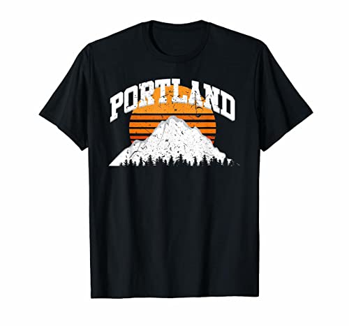 Black t-shirt with distressed white "Portland" text over a sunset mountain graphic.