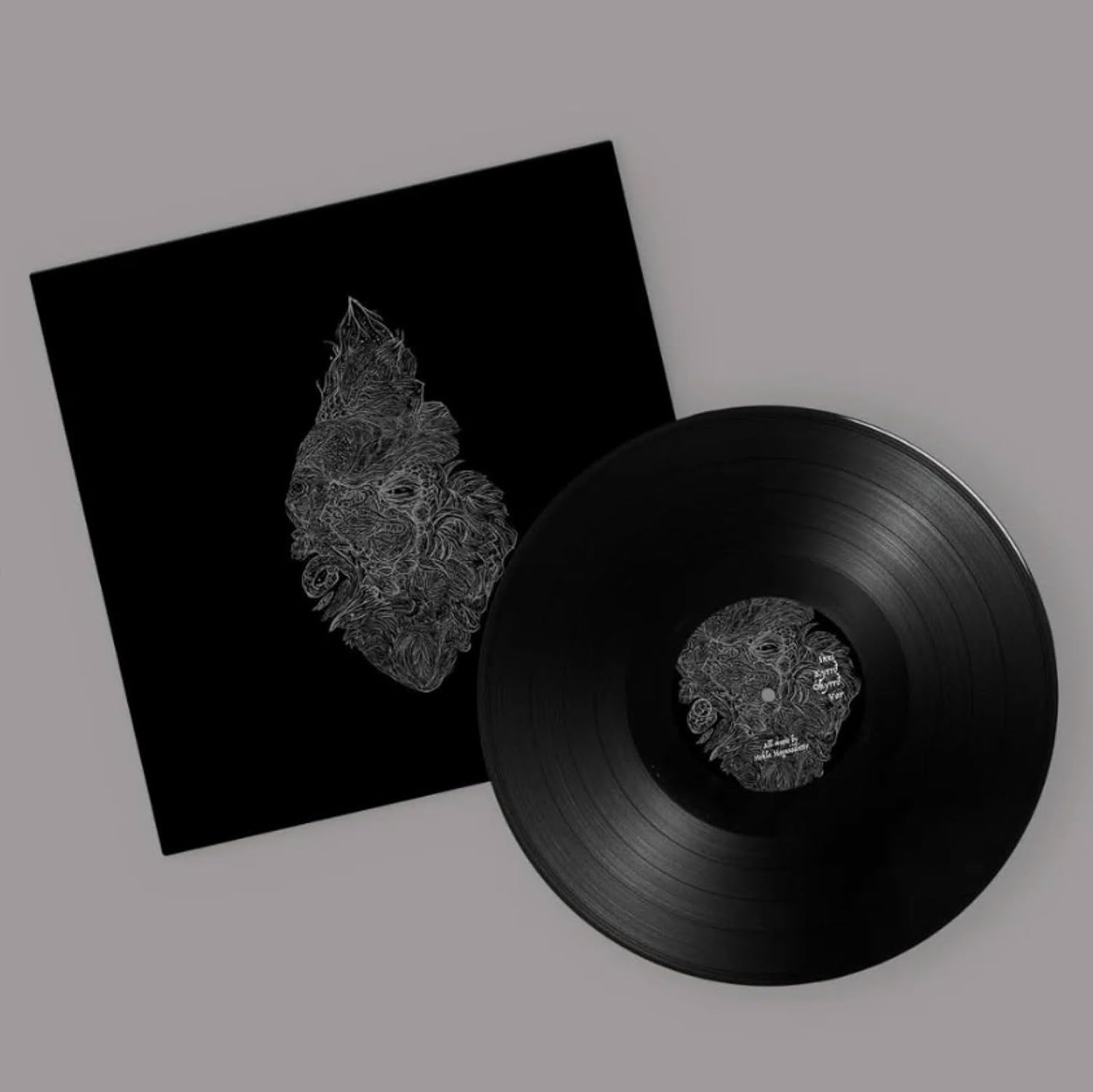 Black vinyl record and sleeve with detailed, white line art design.