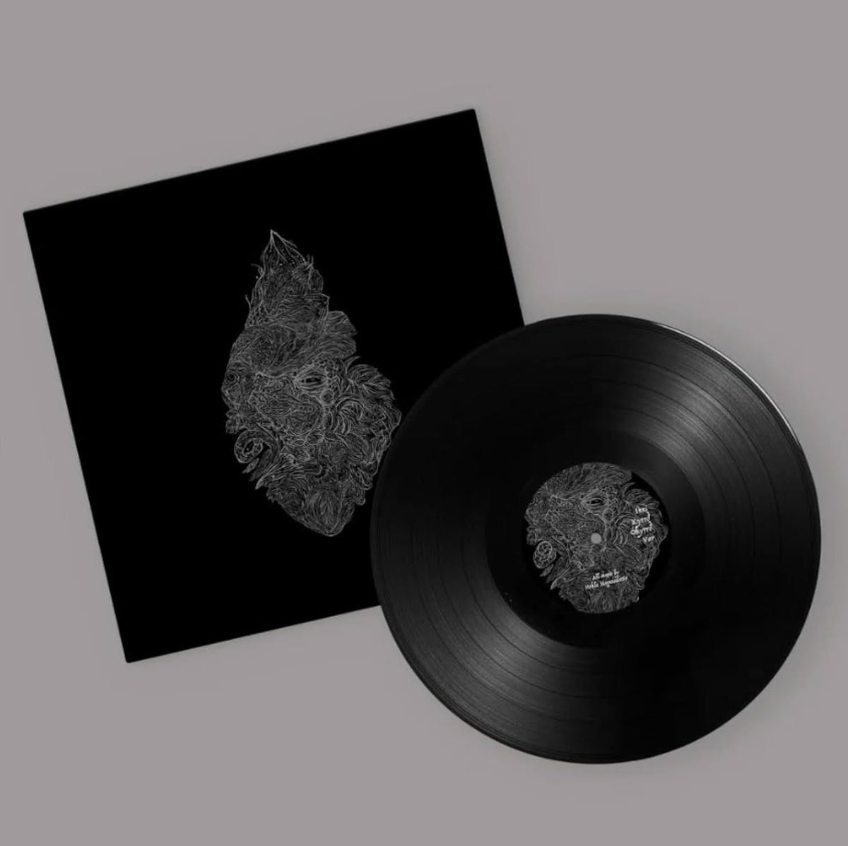 Black vinyl record and sleeve with detailed, white line art design.