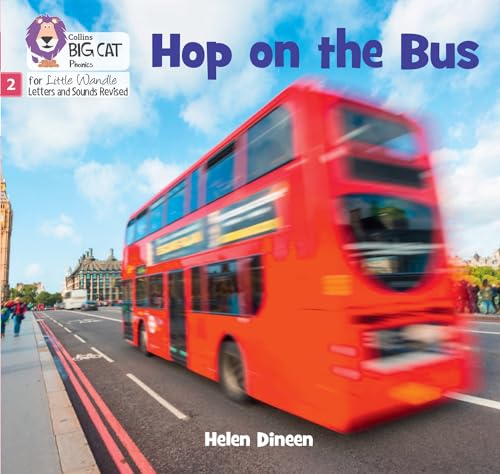 Red double-decker bus speeding past buildings under a blue sky.