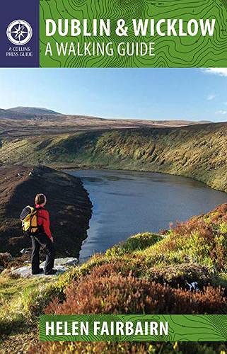 Walking guide cover with hiker overlooking a lake in Wicklow Mountains.