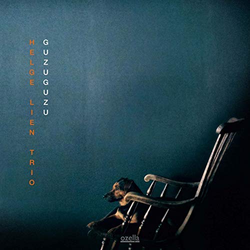 CD cover: dog in rocking chair, dark blue background, orange text.