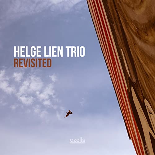 Album cover for Helge Lien Trio’s “Revisited” with sky and red stripes.