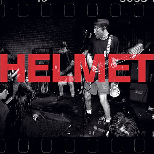 Black and white photo of Helmet band performing live on stage.