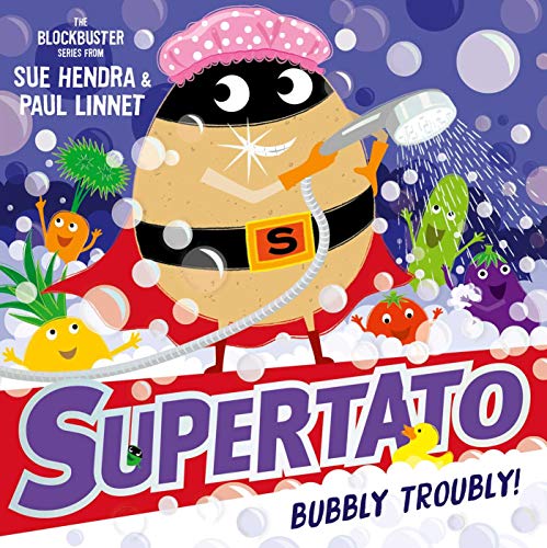 Superpotato in a cape taking a bubble bath with vegetables.