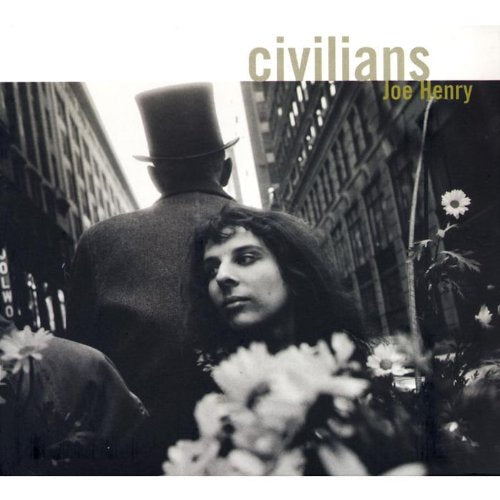 Black and white CD cover with people and city buildings.