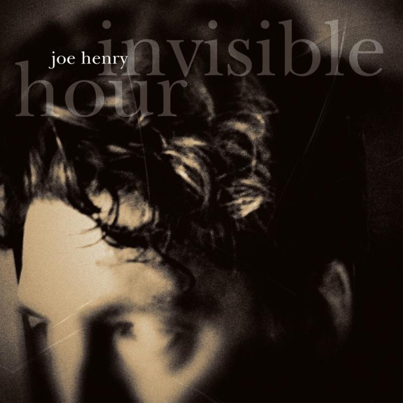 Joe Henry's "Invisible Hour" CD cover, a blurry portrait in shadow.