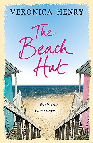 Book cover for The Beach Hut by Veronica Henry showing beach huts and ocean.