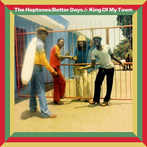 Three men stand in front of a metal gate on this music album cover.