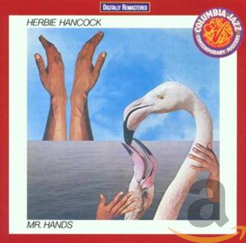 Album cover showing human hands interacting with a flamingo against a blue sky background.
