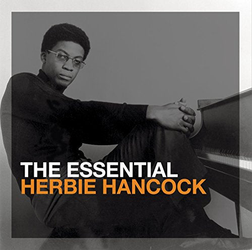 Herbie Hancock portrait on CD cover, wearing glasses and seated at a piano.