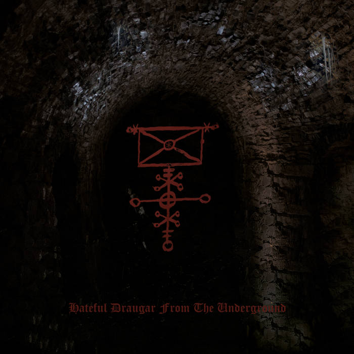Dark stone archway with a red, complex symbol at its center.