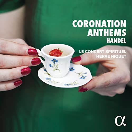 CD cover: hands holding a teacup with a strawberry, green background.