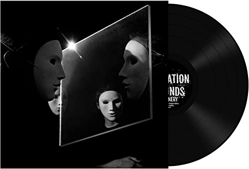 Vinyl record with album art featuring masked faces in grayscale.