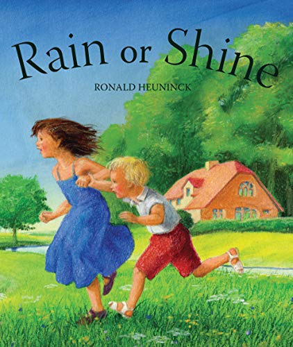 Two children running on grass towards a house under a blue sky.