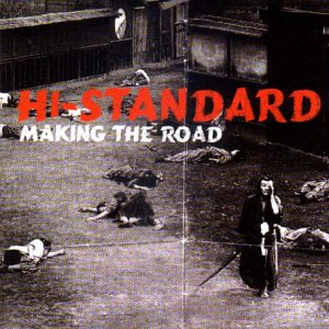 Vinyl record cover: black and white image of people in a street.