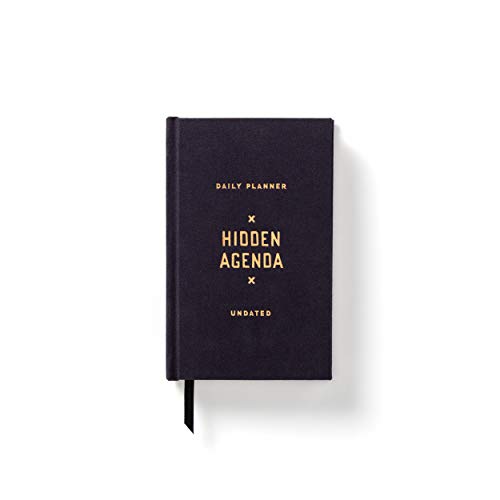 Black mini planner with gold text reading "Hidden Agenda" and "Undated".