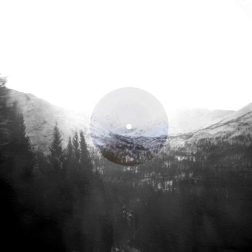 Vinyl record with a snowy mountain range image overlay.