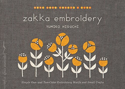 Book cover featuring yellow embroidered flowers on a dark gray linen background.