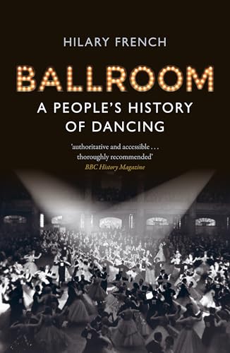 Black and white photo of people dancing on a crowded ballroom floor at night.